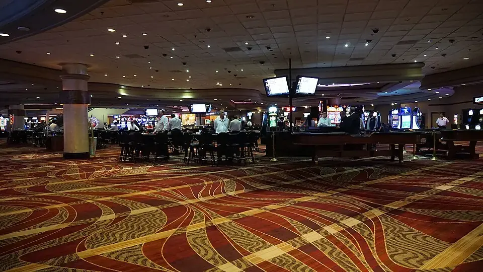 Casino floor with gaming tables and slot machines